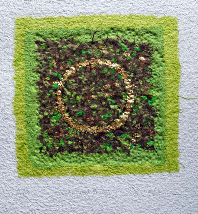 embossed collage by textural artist gill hickman in green & brown with a gold leaf circle