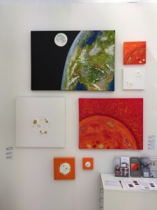My display on works on canvas including "Above and Beyond" at the top.